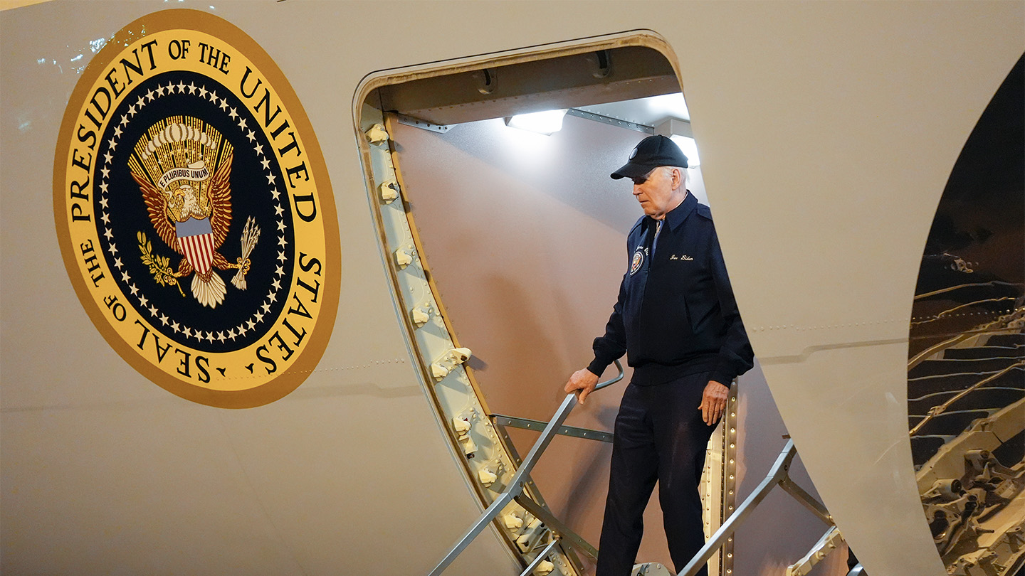 President Joe Biden exits Air Force One, the presidential plane